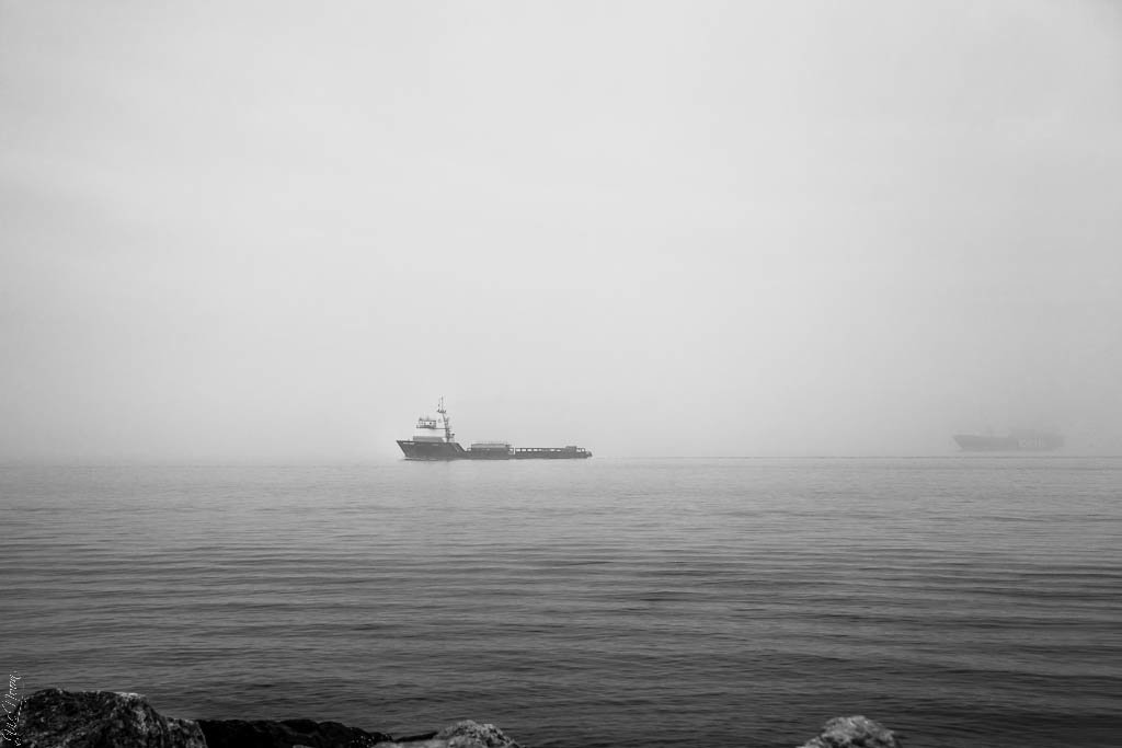 Boat in the fog - Vic Noon