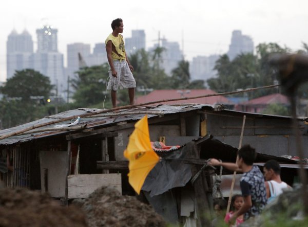 Новости в фотографиях - Тайфун Хаян унес жизни более 10 тысяч человек - №1