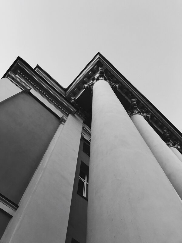 Corner of a building column against the sky - Roman Griev