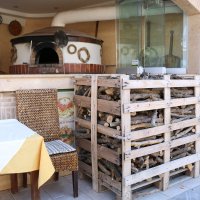 Запасы дров у кафе национальной кухни :: Ольга Запасы дров у кафе национальной кухни :: Ольга